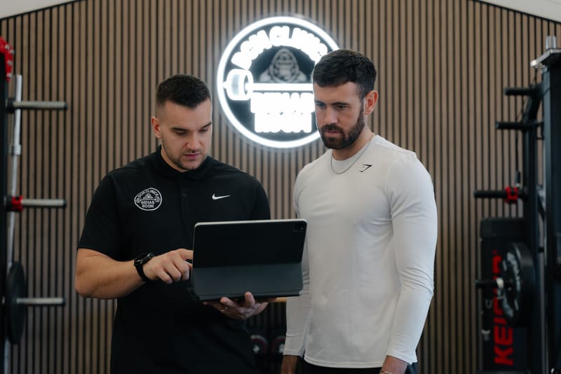 Coach and athlete reviewing a training programme